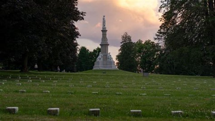 Can a divorced spouse be buried in a national cemetery?